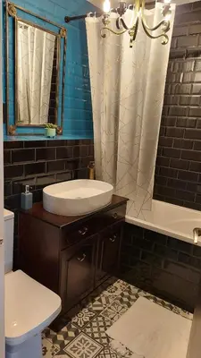 a bathroom with a sink and a tub and a toilet at Luxurious room with a private bathtub and shared toilet and kitchen 10mins from City Centre in Bailleston