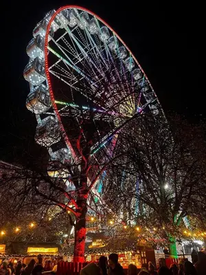 a large ferris wheel is lit up at night at Haymaeket Centro Edinburgh in Edinburgh