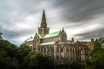 a large cathedral with a steeple on a cloudy sky at La Casita, Quarry - 2 bedroom Entire Apartment with Free Parking in Glasgow
