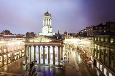 a building with a clock tower in a city at night at La Casita, Quarry - 2 bedroom Entire Apartment with Free Parking in Glasgow