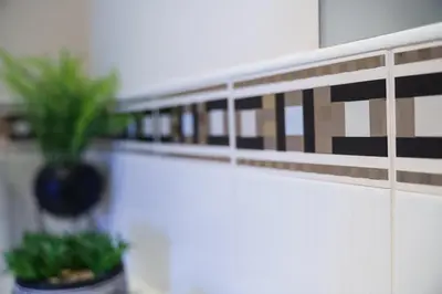 a shelf with a potted plant on a wall at 5 Bed Finnieston SkyHigh Duplex with Parking in Glasgow