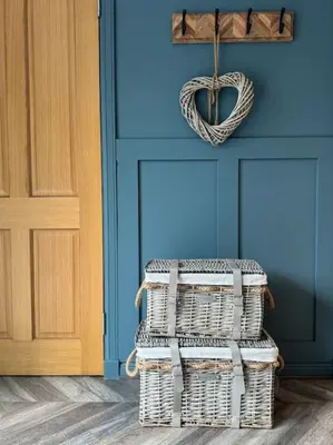 a room with two wicker baskets in front of a door at Stylish House with hot tub in Dalry