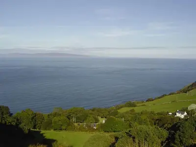 an aerial view of a house and the ocean at Coolranny Schoolhouse in Torr