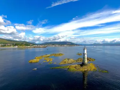 a lighthouse in the middle of a body of water at St Ives Boutique Hotel in Dunoon
