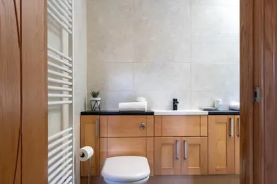a bathroom with a toilet and a sink at The Hill in Tillicoultry