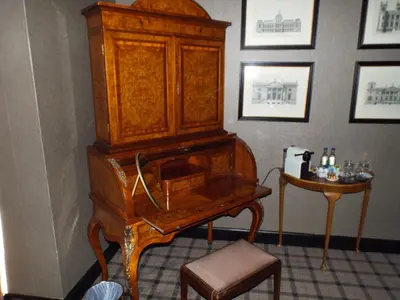 an old wooden organ and a table in a room at Forrester Park Resort in Dunfermline