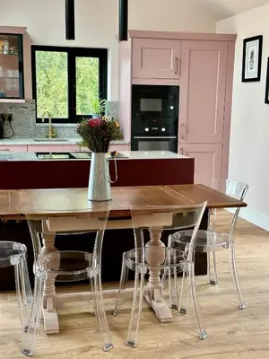 a kitchen with a wooden table and chairs at Firth View 1 - Luxury Cottage with Sea View & Hot Tub, Ayr in Ayr