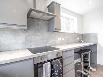 a kitchen with a sink and a counter top at Renfrew Town Centre Easy Link to Glasgow City - Pass the Keys in Renfrew