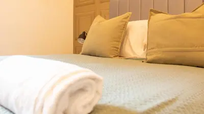 a close up of a bed with pillows at Renton Apartment in Renton