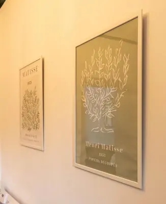 two framed pictures of a tree on a wall at Renton Apartment in Renton