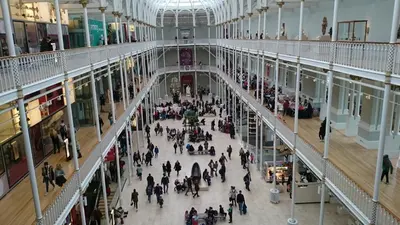 an overhead view of a crowd of people in a shopping mall at Violet Bank Apartment Morningside in Edinburgh