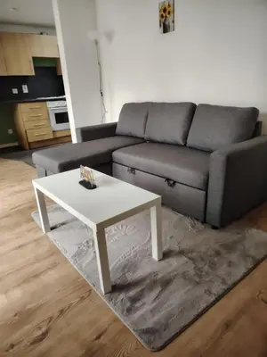 a living room with a couch and a white coffee table at Bright Edinburgh Flat - City Center EB7 in Edinburgh