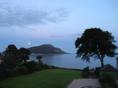 a view of a body of water with a tree at Seaview Cottage in Lamlash