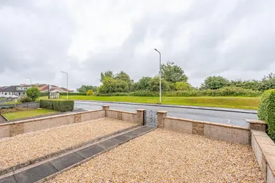 a view of a road with a park at Cowden Coorie in Fife