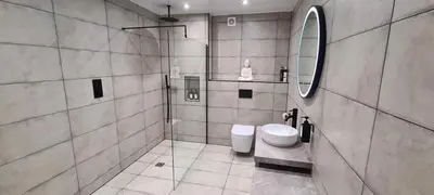 a bathroom with a toilet and a mirror at The Old Courthouse in Rothesay