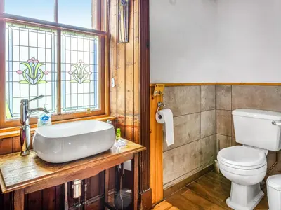 a bathroom with a sink and a toilet at Burncliff in Blackwaterfoot