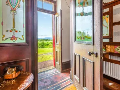 an open door to a room with a view at Burncliff in Blackwaterfoot