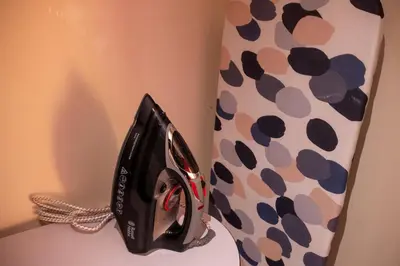 a black and white tie with polka dots on it at 2 Bedroom Beautiful Apartment in Motherwell in Mossend