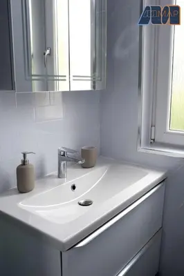 a bathroom with a white sink and a mirror at Paisley Haven on Renfrew Road in Merksworth