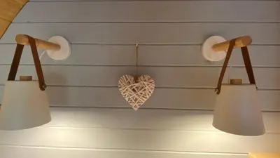 a pair of lights with a heart on the wall at The Fells - Campsie Luxury Pods with hot tub in Glasgow