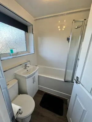 a bathroom with a toilet and a sink and a shower at Seaside Apartment in Helensburgh