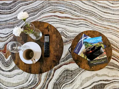 a table with a plate of food and a cup of coffee at Glasgow Green Modern Stay in Glasgow