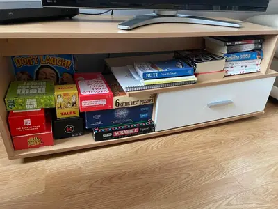 a book shelf with a bunch of books at Fraoch, Pets welcome in Port Bannatyne