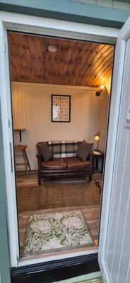 a view of a living room with a couch at North Muasdale Farm, Ewe View in Muasdale