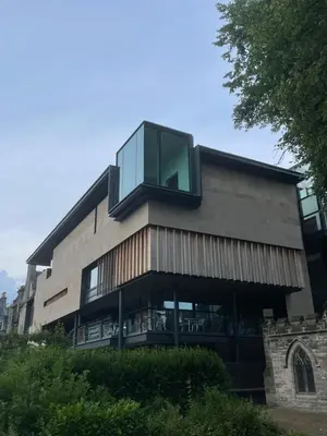 a building with a glass window on the side of it at Foundry Street Apartment 2 - Dunfermline city centre in Dunfermline