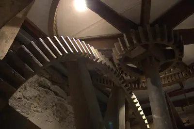 a bunch of spiral stairs in a building at The Old Mill Bed & Breakfast in Biggar