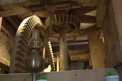 a wooden spiral staircase in a wooden building at The Old Mill Bed & Breakfast in Biggar
