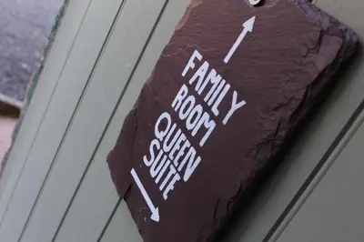 a chocolate cake with the words familyory cookie survey on it at The Old Mill Bed & Breakfast in Biggar