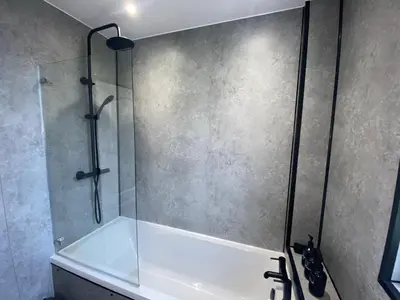 a shower with a glass door in a bathroom at Glasgow Apartment close to the airport in Renfrew
