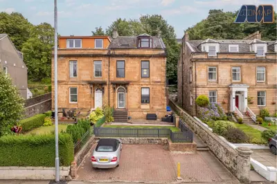 an old house with a car parked in front of it at Albert Road in Gourock