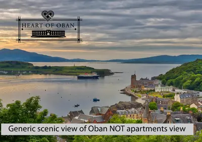 a view of a town and a river with a boat at Heart of Oban in Oban