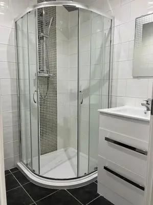 a bathroom with a shower and a sink at Kirkton Rest in Cardross