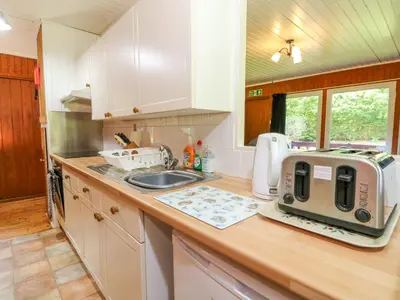 a kitchen with a sink and a toaster on a counter at Lodge 1 