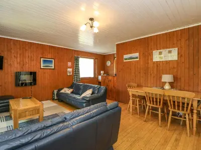 a living room with a couch and a table at Lodge 6 - 
