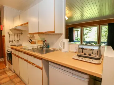 a kitchen with a sink and a counter top at Lodge 4 - 