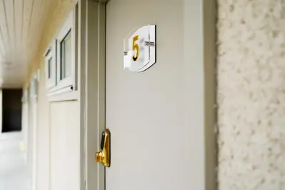 a door with the number thirty six on it at Powfoulis Inn in Falkirk
