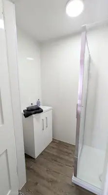 a bathroom with a sink and a shower at Campbeltown Retreat in Campbeltown
