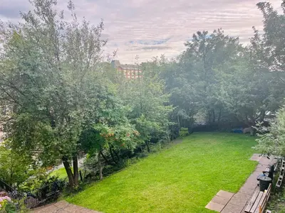 a view of a yard with trees and grass at Castle View Retreat in Edinburgh