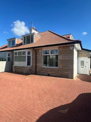 a brick driveway in front of a house at Entire Private 1 Bedroom - Guest Suite in Glasgow in Glasgow