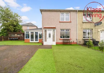 a house with a large yard in front of it at Fraser House by Klass Living Rutherglen in Glasgow