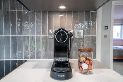a blender on a counter with eggs in a glass jar at Cottage with Hot Tub near Knockhill in Saline