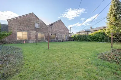 an empty yard in front of a brick house at Craignish Apartments in Falkirk