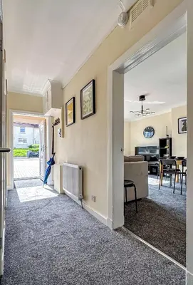an open hallway with a living room and a dining room at Colourful life-house near Glasgow in Clydebank