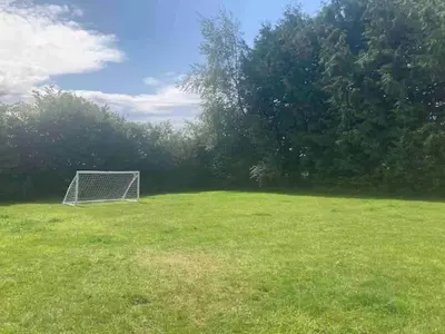 a soccer goal in the middle of a field at Siskin Cottage in Lochgilphead
