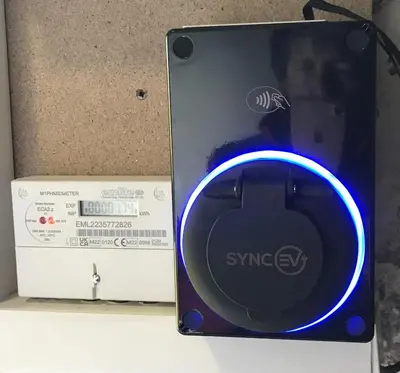 a ipod nano with a blue light next to a box at Ballat Smithy Cottage in Drymen