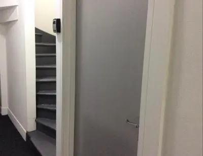 a door leading to a staircase in a room at 103 NELSON STREET Aubery in Largs